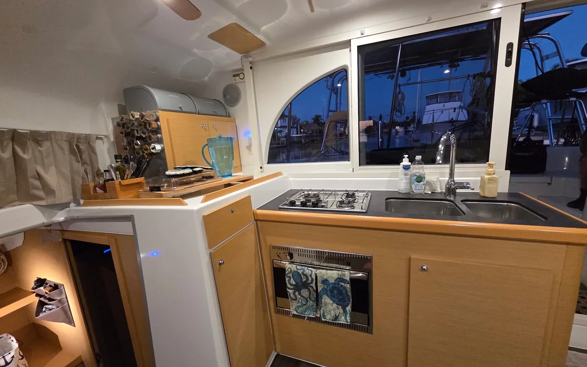 Majik’s galley: two-burner stove, oven, double sink and wood cabinets